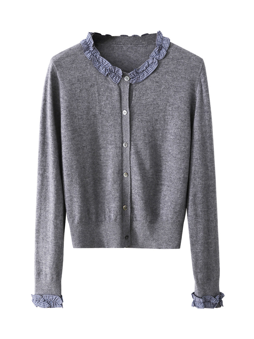 Gray button-up cardigan sweater with ruffled collar and cuffs on a white background