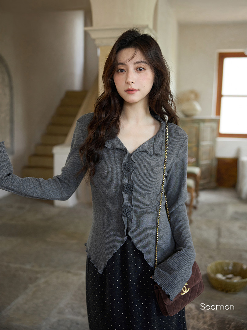 Gray knit long-sleeve cardigan worn by a model with a shoulder bag