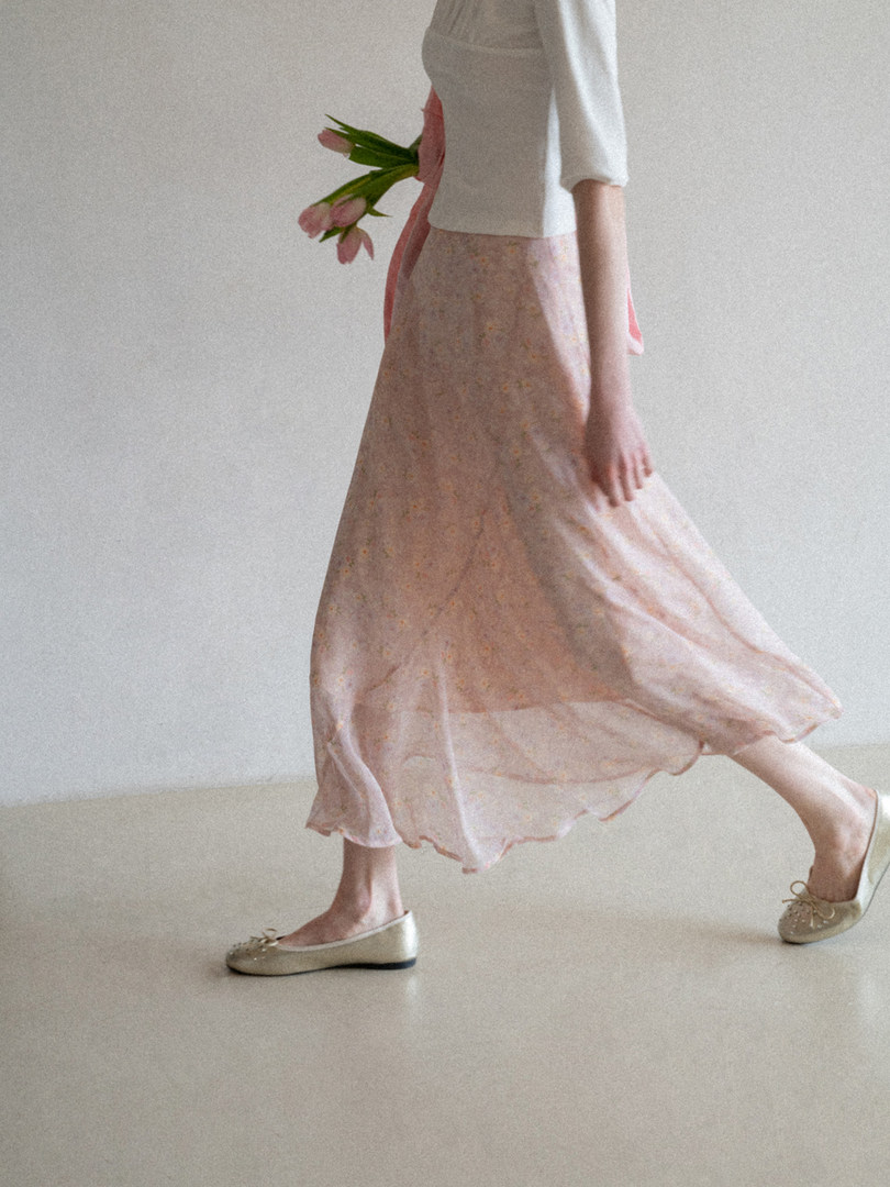 Pastel floral skirt outfit worn with ballet flats