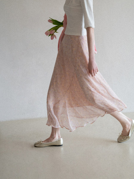 Pastel floral skirt outfit worn with ballet flats