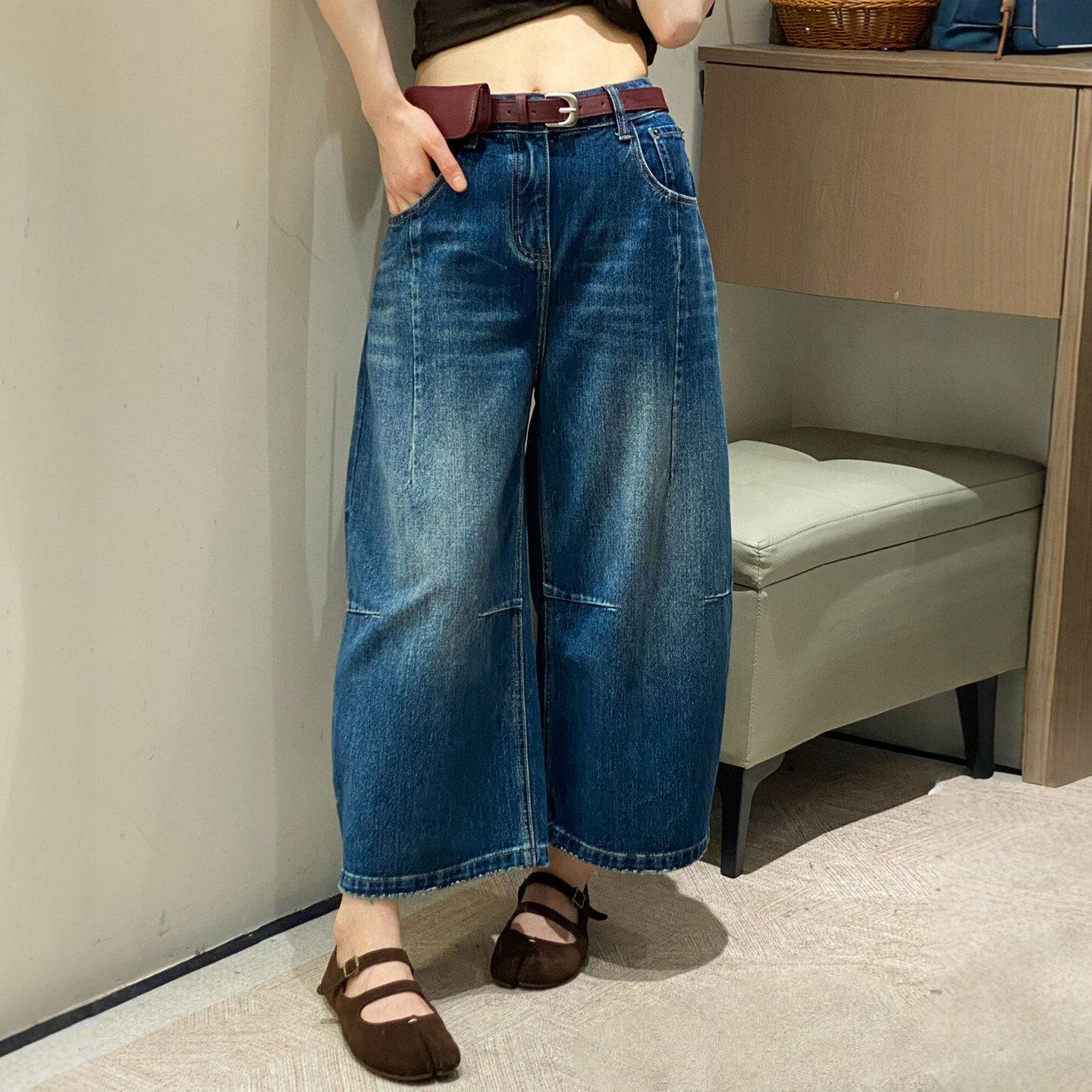 配腰包八分弯刀阔腿牛仔裤女欧货