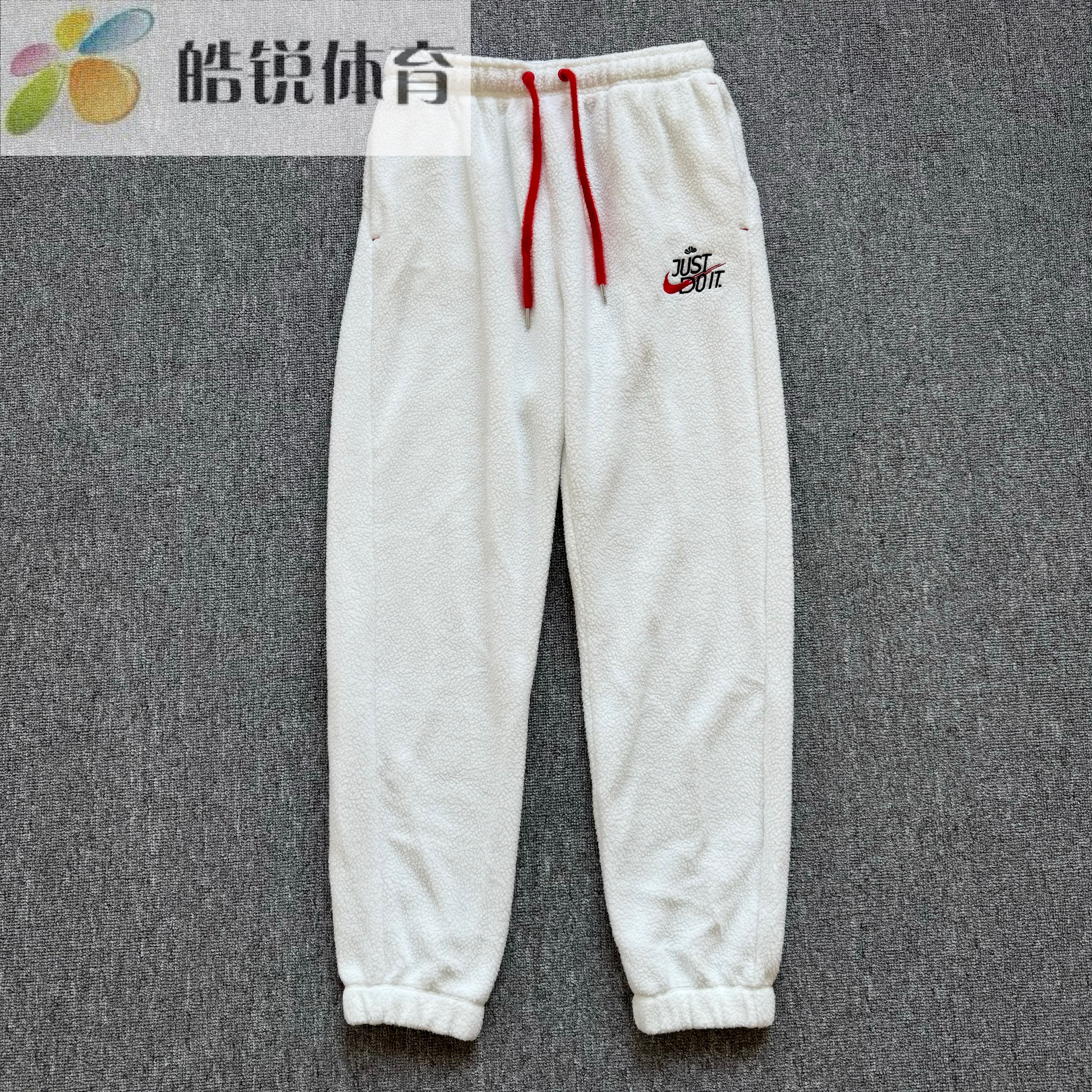 Nike耐克女子刺绣logo羊羔绒保暖运动休闲束脚长裤FD4069-121