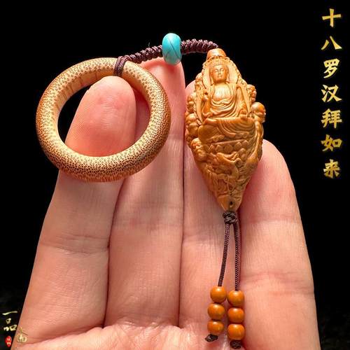 十八罗汉拜如来橄榄核手把件