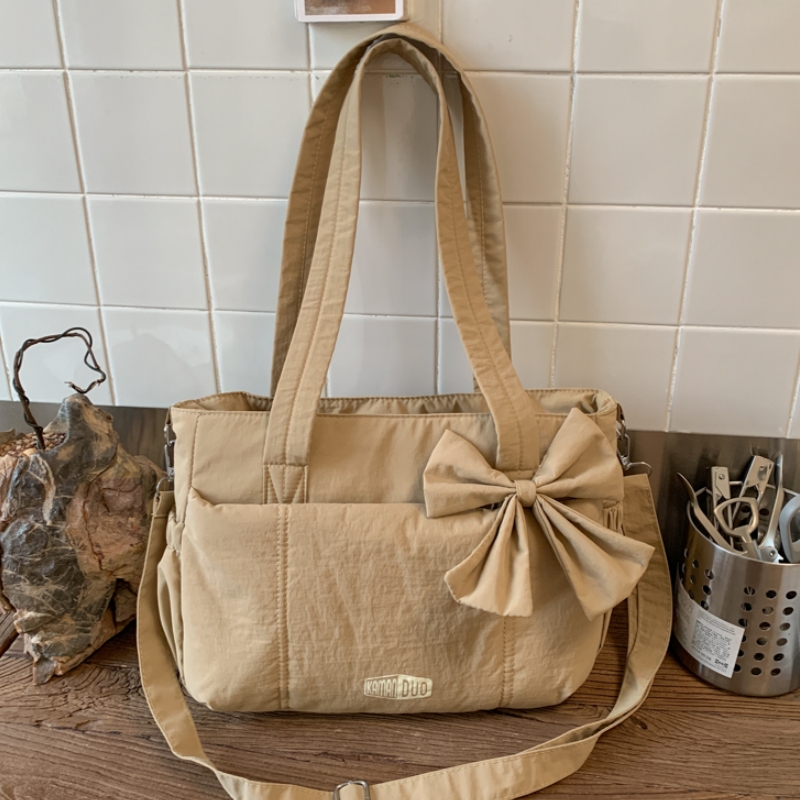 学院风可爱少女手提包日系纯色百搭通勤单肩包女简约斜挎包补习袋