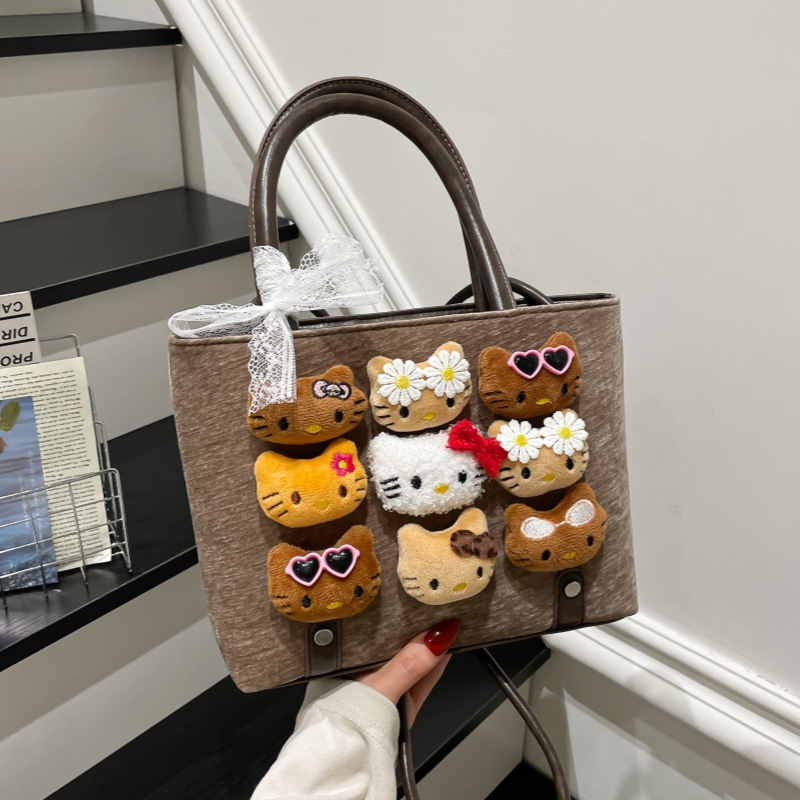 可爱猫卡通手提水桶包2025新款女百搭单肩斜挎包玩偶包包通勤时尚