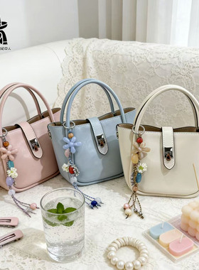 稻草人牛皮女包2026春季新款糖果色水桶包女单肩斜挎菜篮子手提包