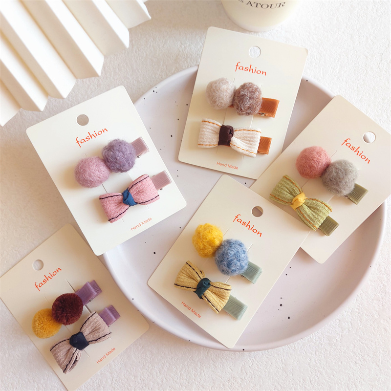 女孩包布平夹暖色调刘海夹