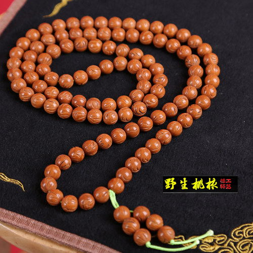 怡轩工艺新款龙纹桃核打磨光珠