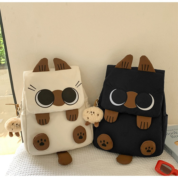 韩版2025书包轻便大容量小学生三到六年级可爱双肩包丑萌猫咪个性