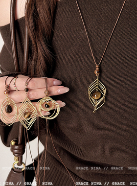 复古轻奢美拉德金属线缠绕虎眼石吊坠项链女长款毛衣链配饰高级感