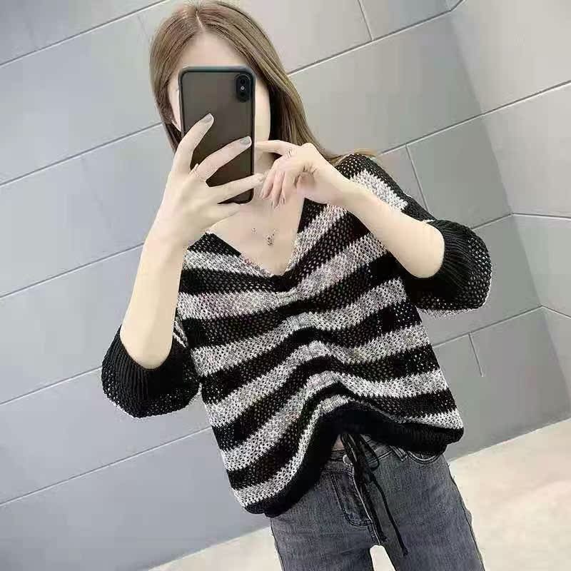 Thin loose neckline hollow out medium sleeve knitted drawstring top knitted over blouse
