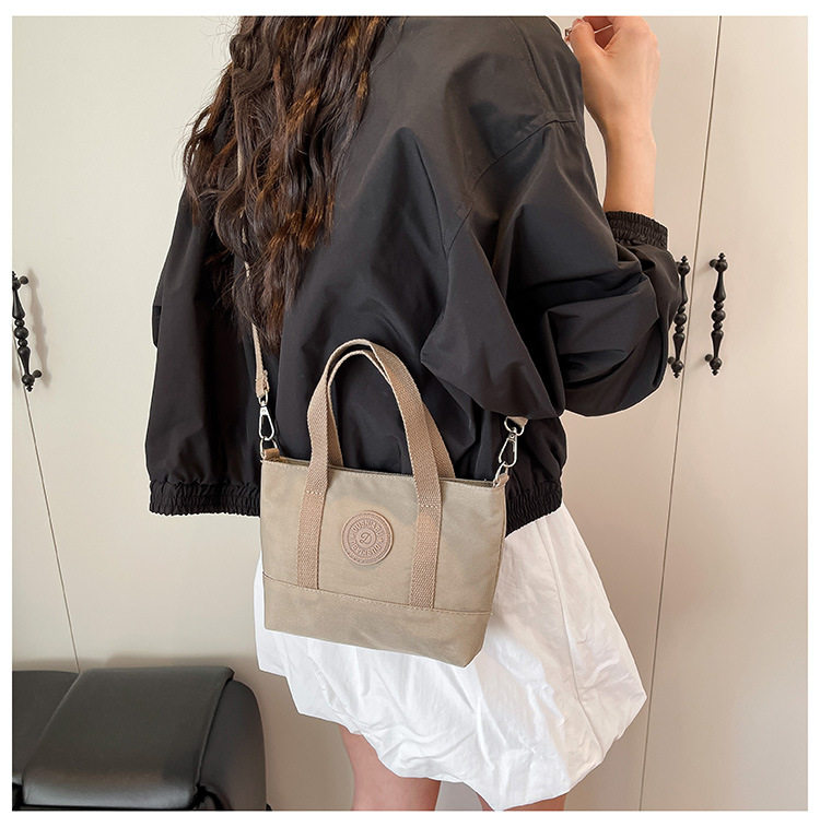 新款纯色牛津布潮时尚手提斜挎两用手机包零钱包休闲通勤小手