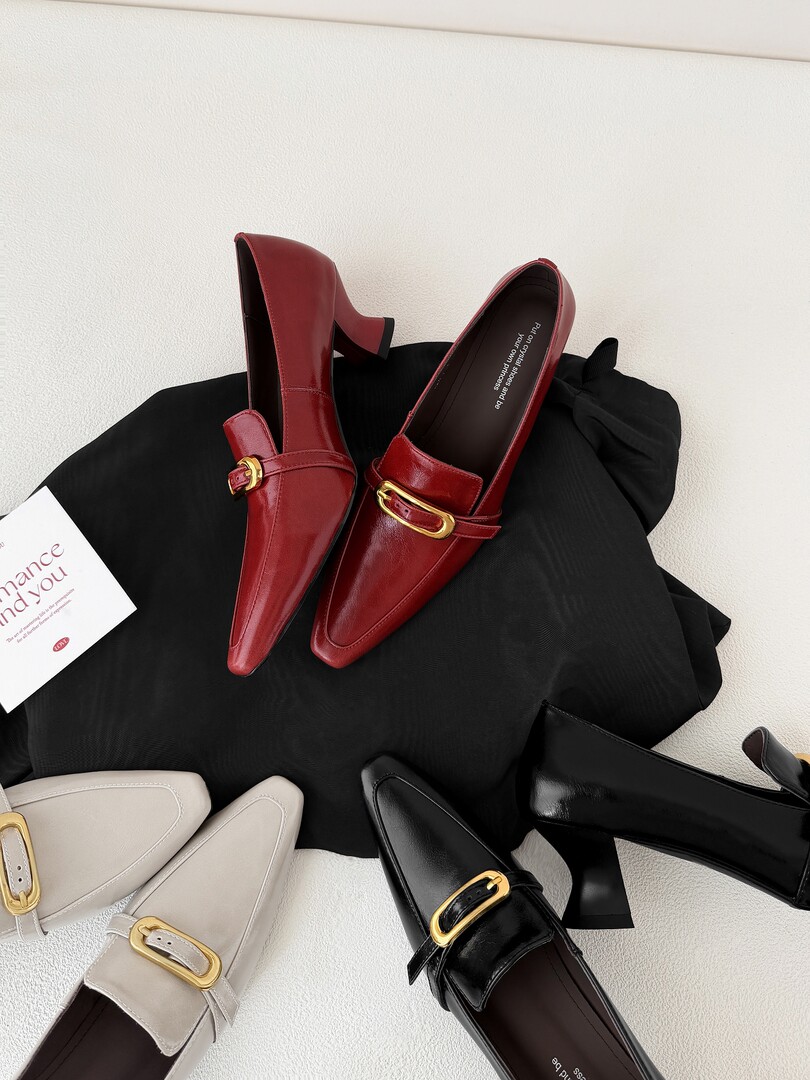 Assorted pointed-toe heeled loafers with gold buckle details