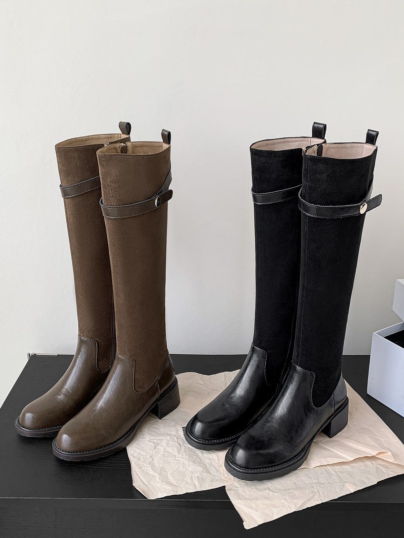 Pair of tall knee-high heeled boots in brown and black