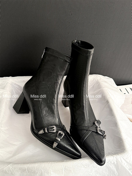 Black pointed-toe heeled ankle boots with buckle details