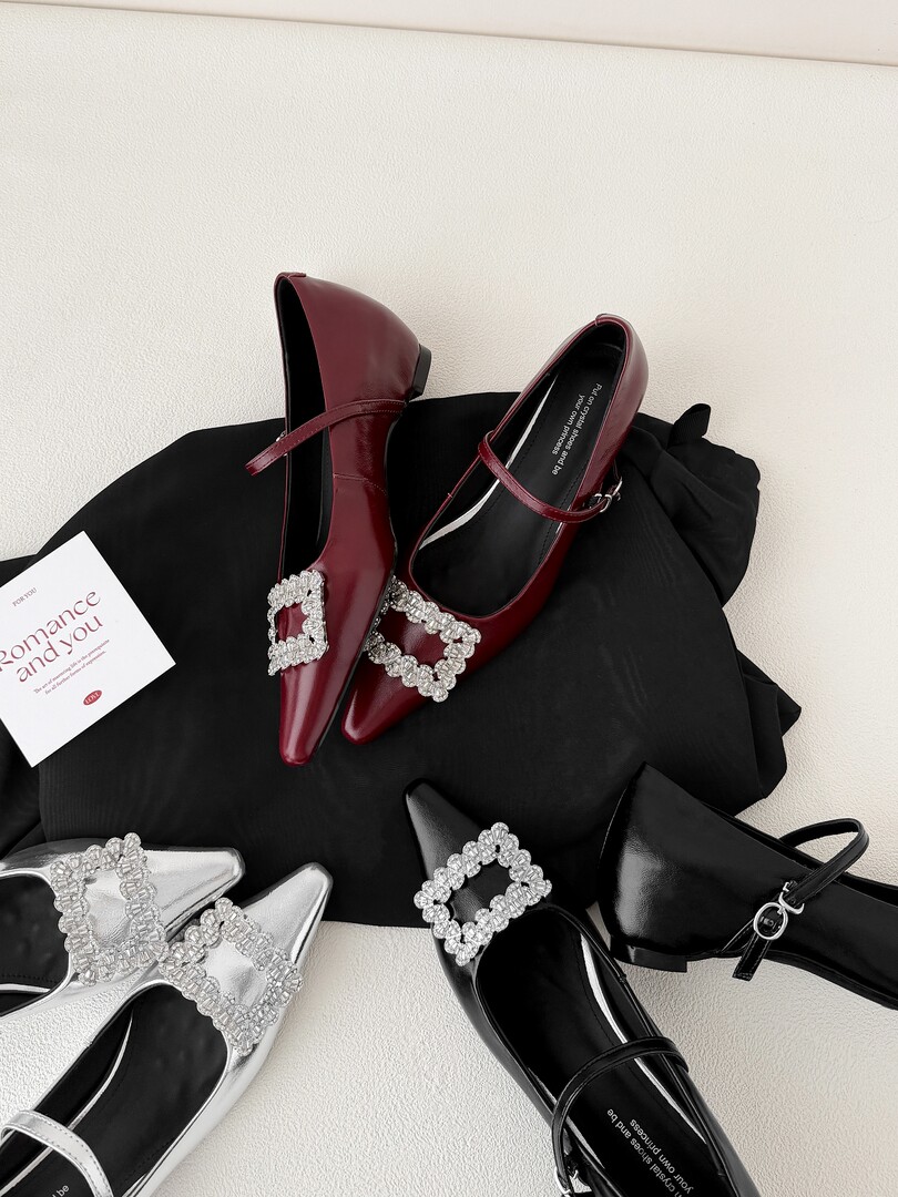 Dressy pointed-toe Mary Jane flats in burgundy, silver, and black with rhinestone buckles