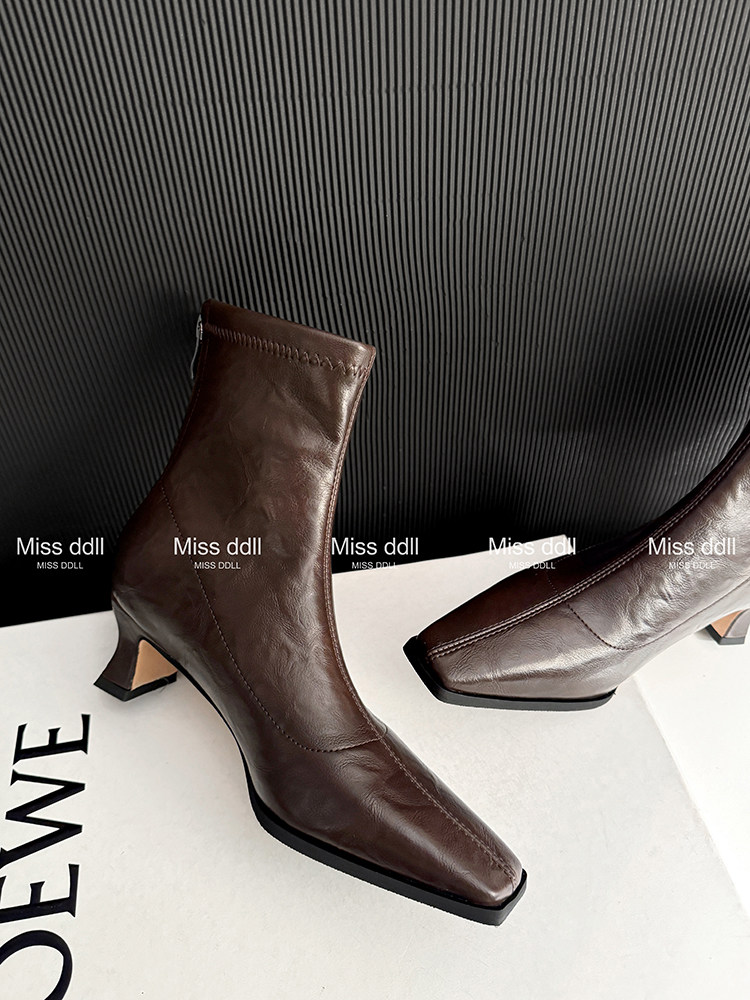 Brown leather ankle boots with pointed toes and block heels