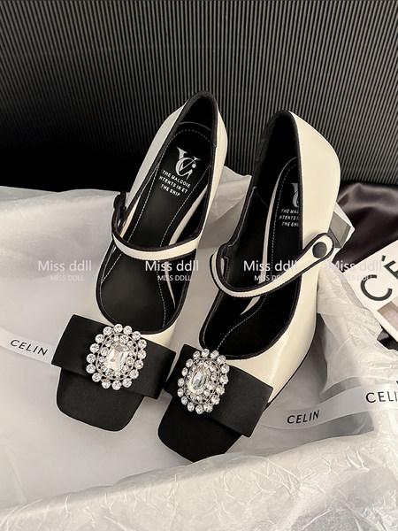 Pair of black and cream embellished Mary Jane heels with jeweled buckles