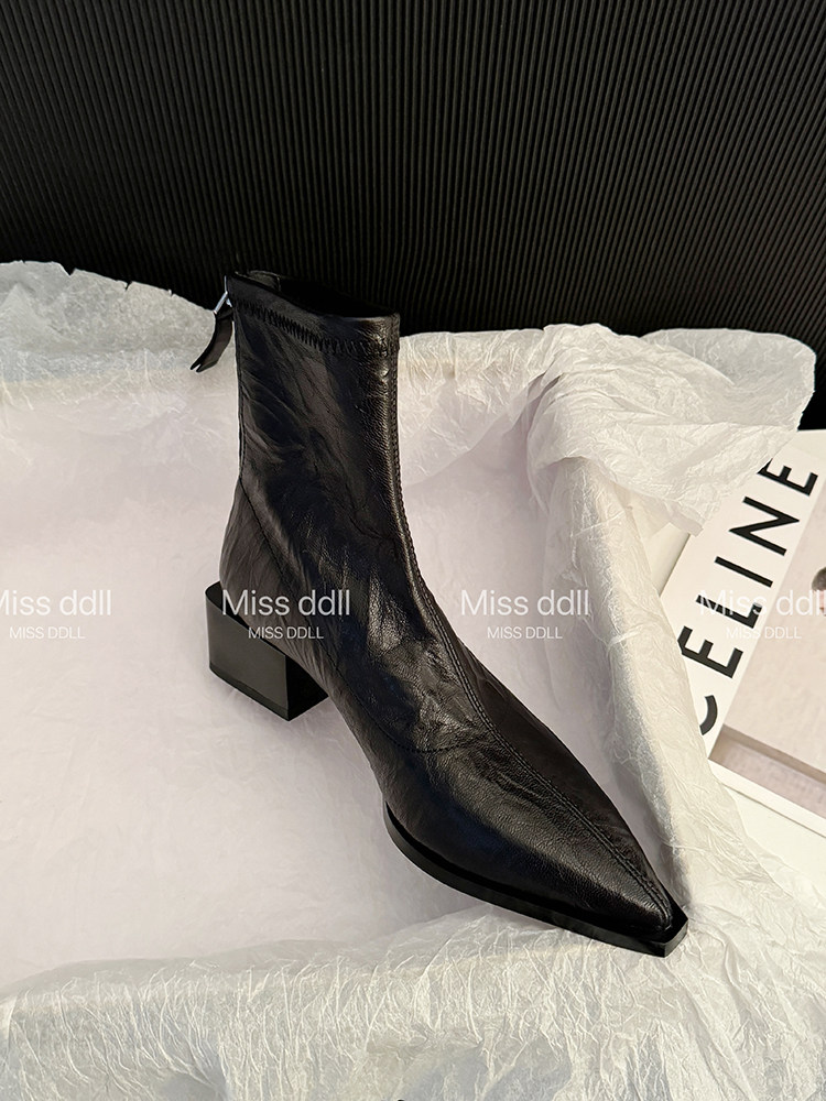 Black leather ankle boot with pointed toe and block heel