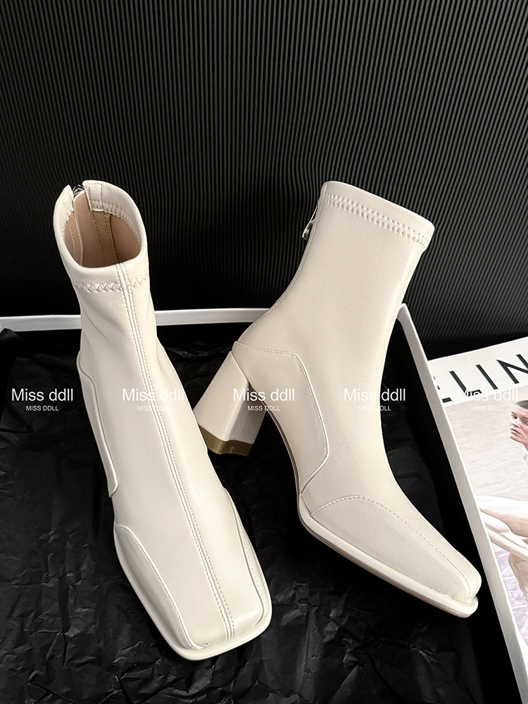 Pair of cream ankle boots with block heels