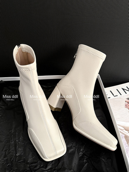 Pair of cream ankle boots with block heels