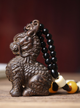 沉香木麒麟手把件瑞兽