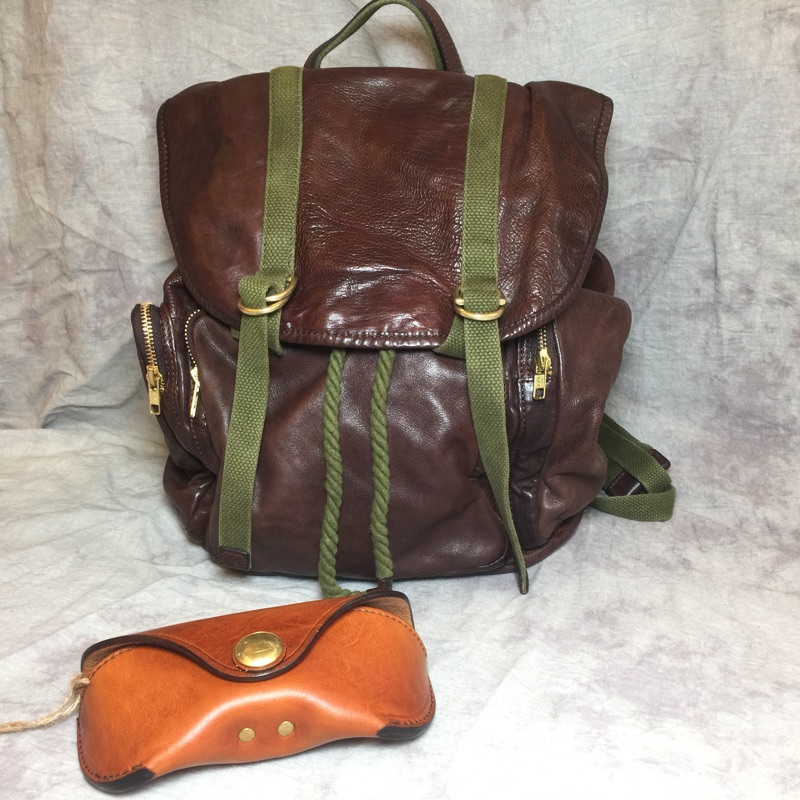 原创牛皮休闲撞色抽绳学生书包