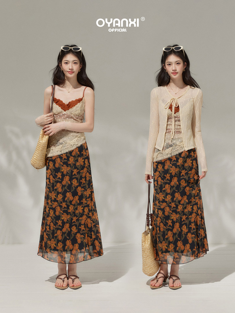 Two models wearing a sheer lace floral maxi skirt outfit with camisole and cardigan