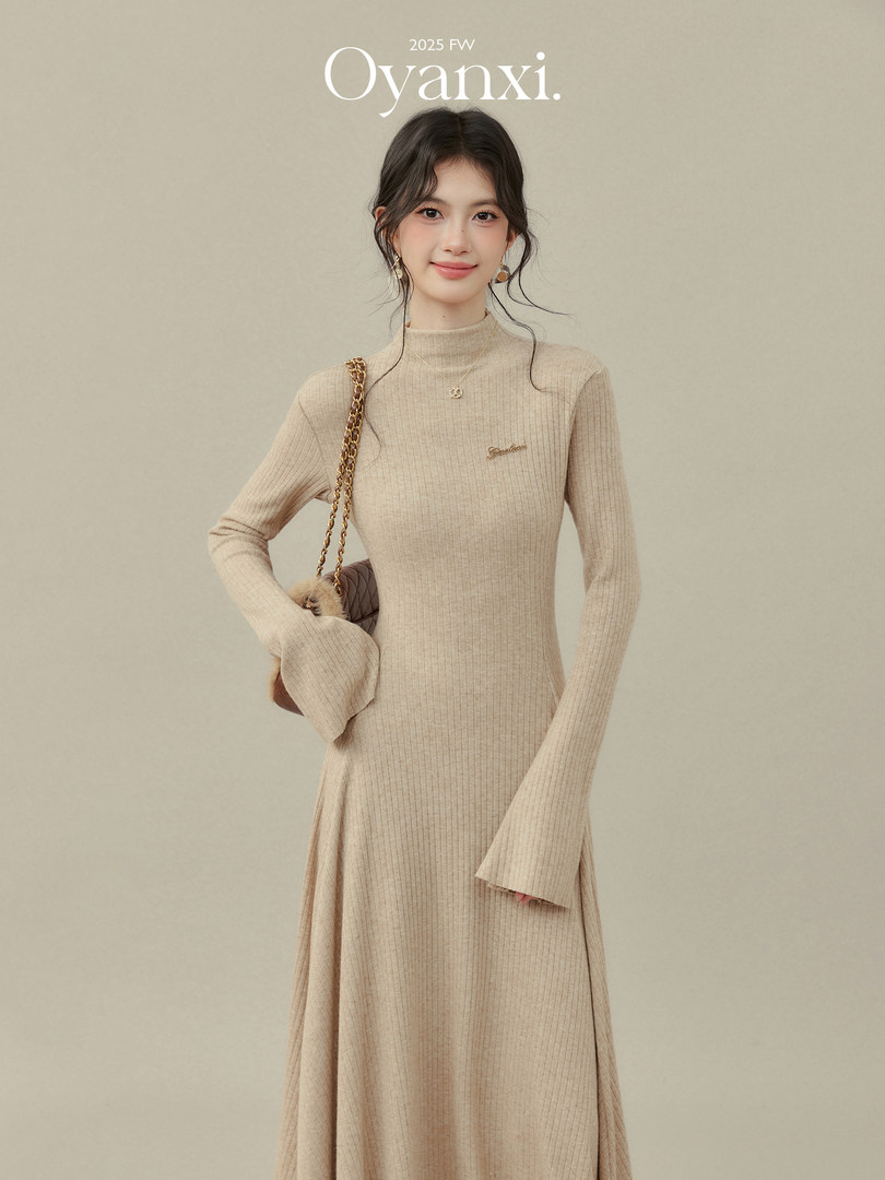 Beige ribbed long-sleeve knit dress worn by a model