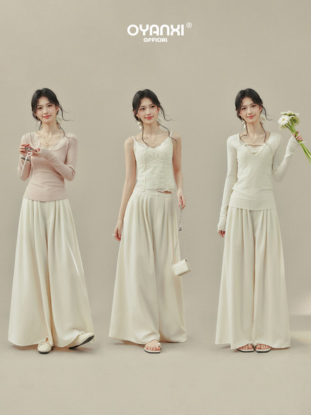 Three women modeling cream and pink feminine outfit sets with lace tops and wide-leg pants