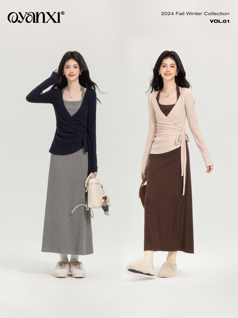 Two models wearing wrap knit tops and long skirts in a fall winter collection
