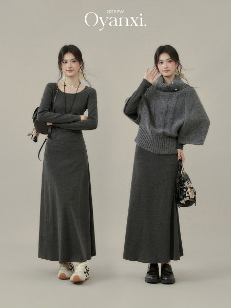 Two models wearing dark gray knit sweater dresses in a fashion promo image