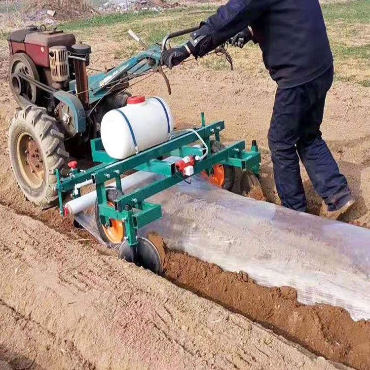 农用地膜覆盖机 小四轮手扶拖拉机带覆膜机 铺滴灌喷药铺膜机图片