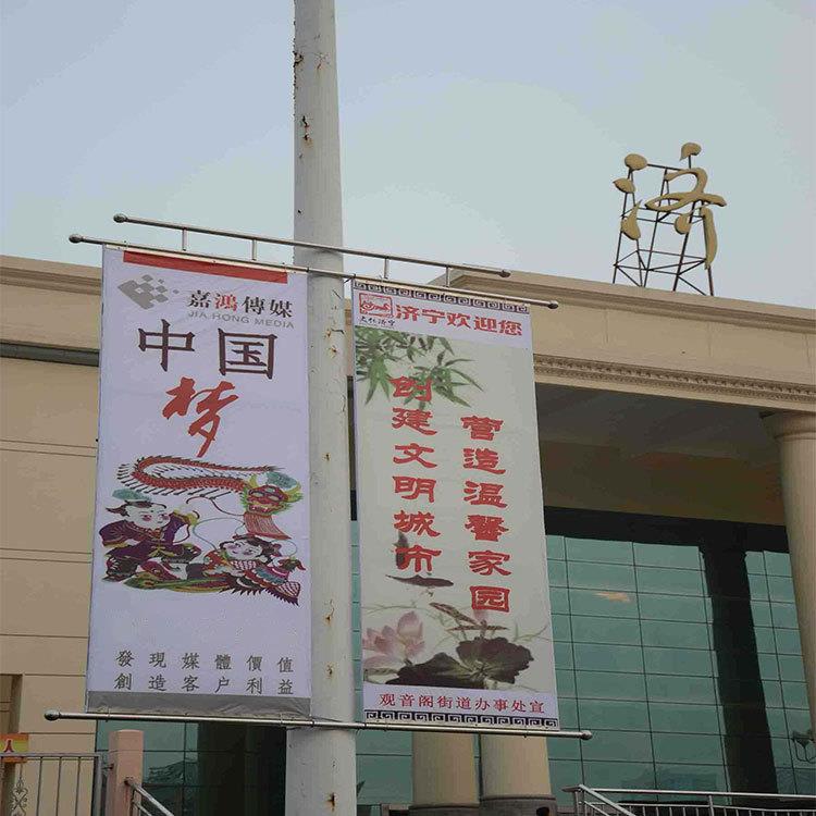 鸿基制作马路道旗广告大批量喷绘生产房地产路灯杆道旗广告量大优