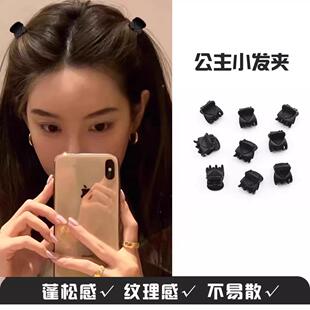 Small black hair clip, accessory for securing hair, bangs, a
