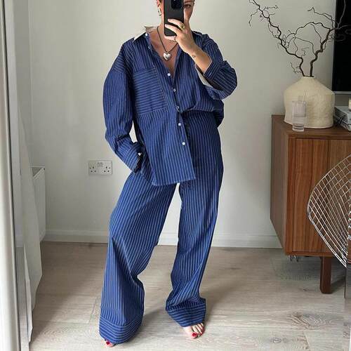 Blue striped suit with black and white lapels for two women