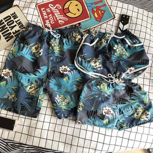A family of three parent-child beach shorts, swimming
