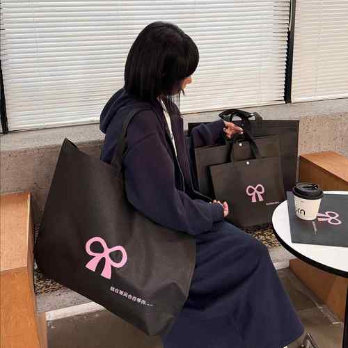 高级服装店无纺布手提袋女装购物大容量包装袋子衣服打包带