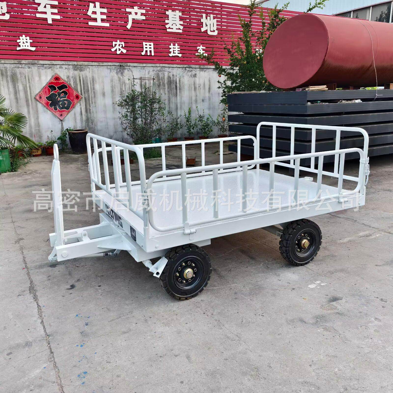 牵引式平板拖车月台搬运货物厂房物流转运车小吨位搬运运输车