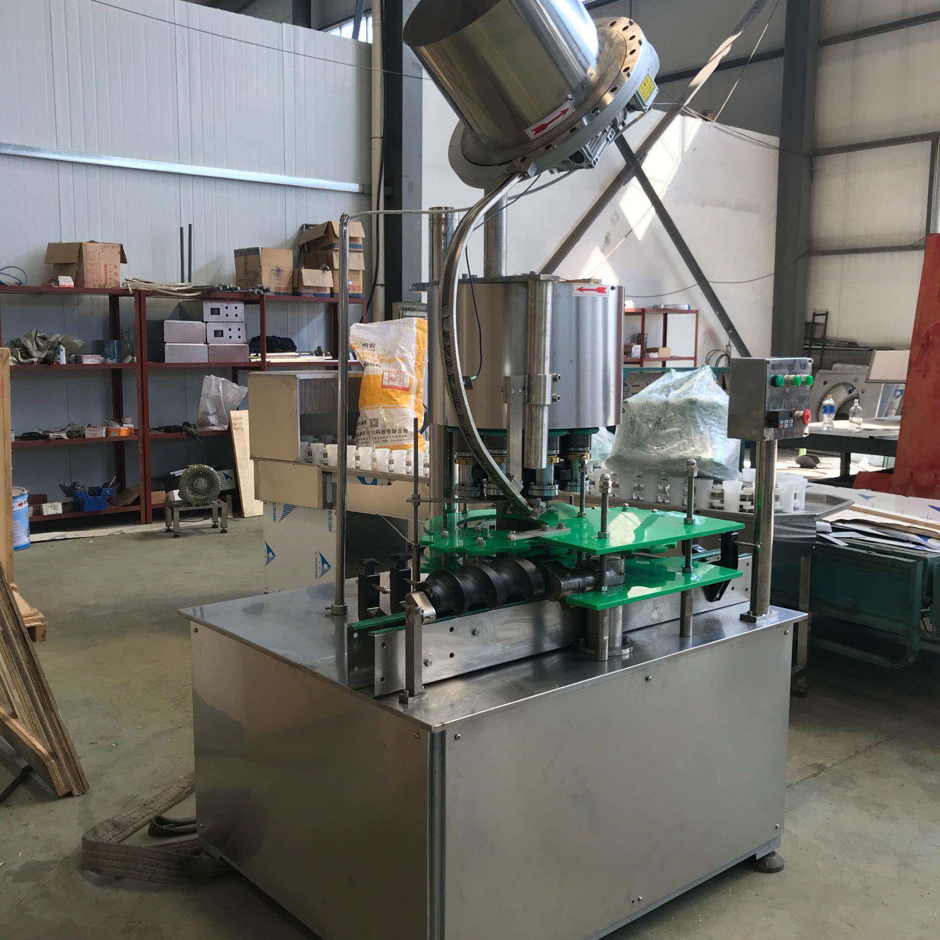 厂家供应全自动菊花盖压盖机菊花皇冠盖果汁压盖机啤酒盖封盖机