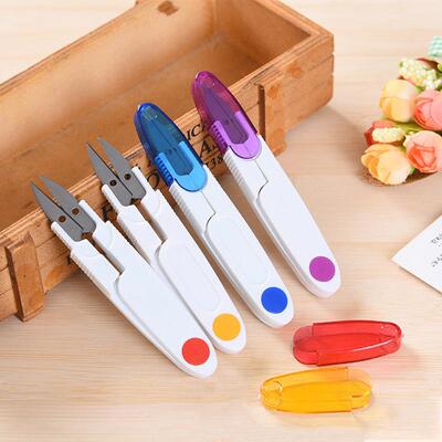 Colored, covered, transparent U-shaped scissors with safety