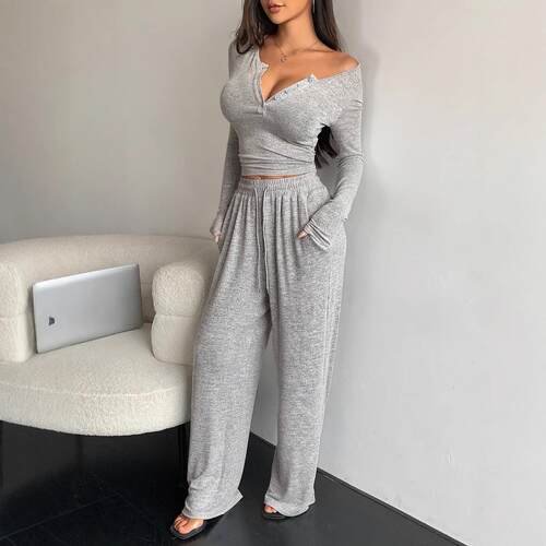 Set long sleeved button up tight fitting top with pants