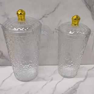 1 pitcher with 4 cups, made of clear plastic, featuring a li