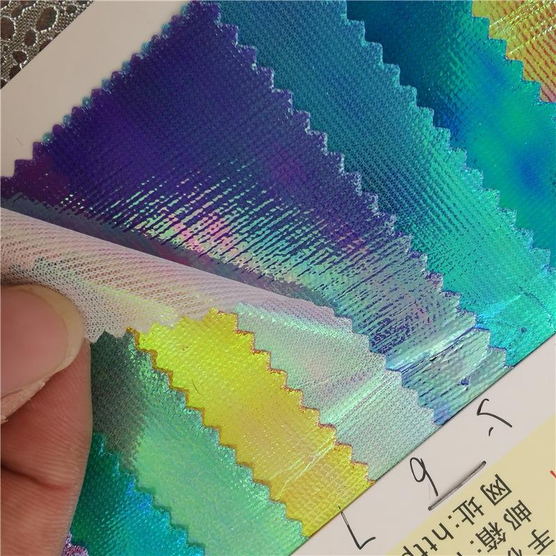 厂家现货全涤幻彩布针织底幻彩膜玩具服装辅料饰品儿童玩具布