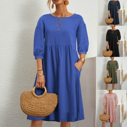 Dress with lantern sleeves, pleated pockets, and pockets
