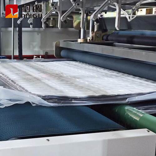 耐锢生产全自动弹簧海绵床垫压缩对折卷包打包机床垫压缩卷包设备