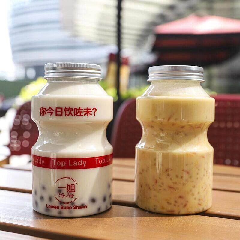 促销一次性奶茶杯带盖子快乐多500ml网红瓶pet饮料瓶商用打包杯空
