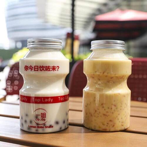 促销一次性奶茶杯带盖子快乐多500ml网红瓶pet饮料瓶商用打包杯空