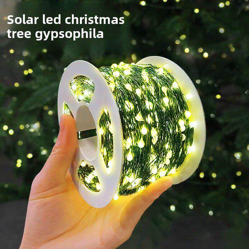 太阳能圣诞树Led装饰气氛灯与深绿色铜线彩色灯串户外防水圣诞布