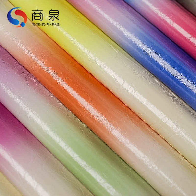批发新款柔软垂感pu人造革无弹时尚男女服装童装粘胶渐变皮革面料